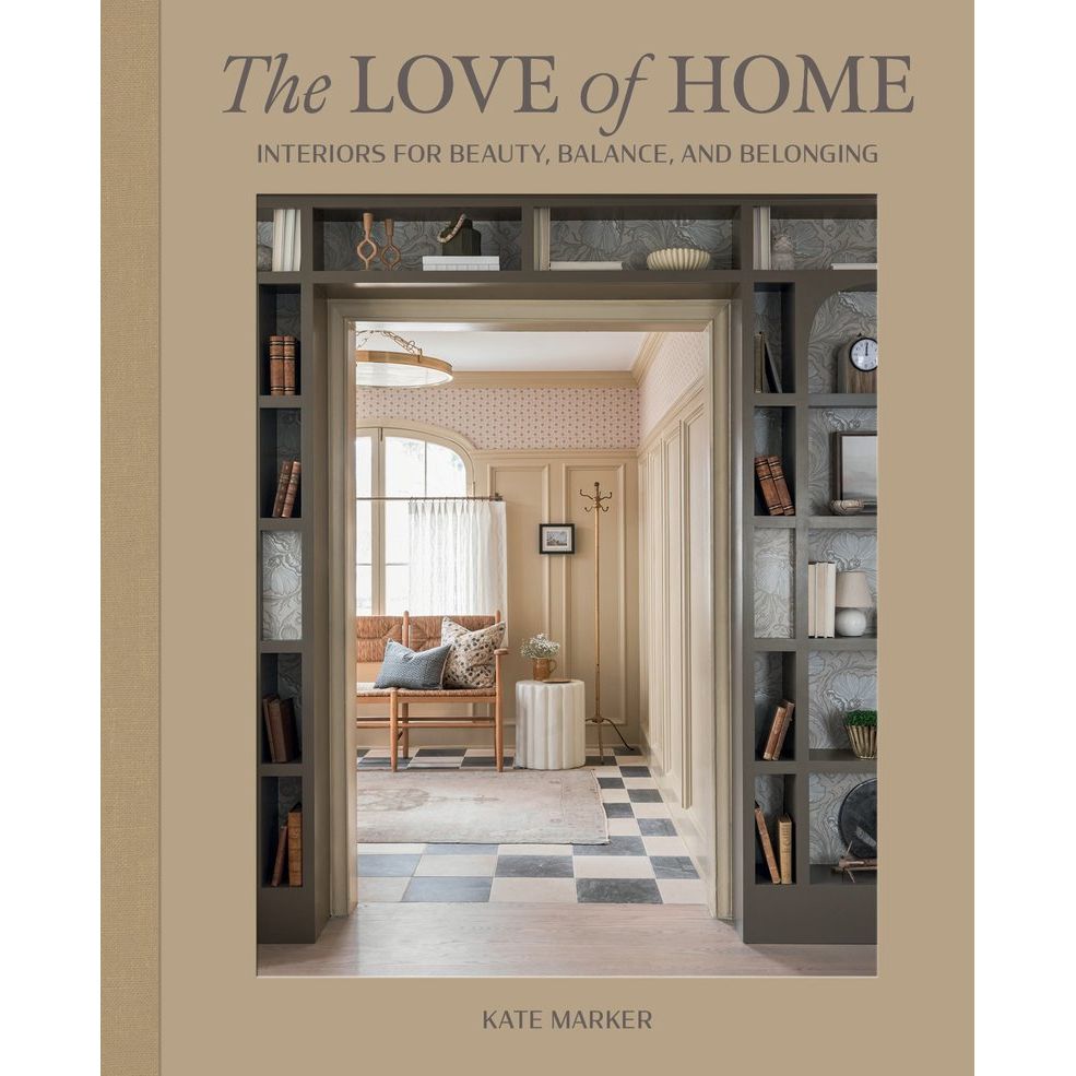 Book cover of 'The Love of Home' by Kate Marker with an interior design scene.